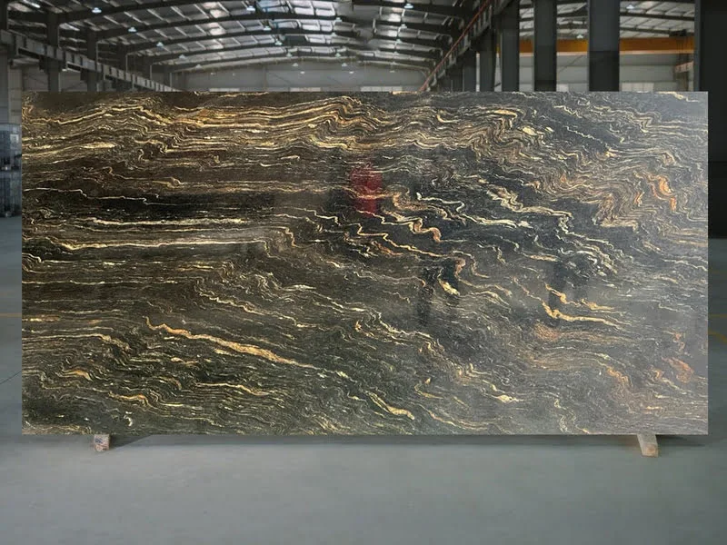 Arizona Gold Granite slab with bold black background and dramatic gold and cream swirls—black granite with gold elements for countertops or feature walls.