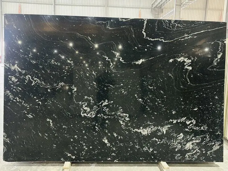 Black granite slab with white swirls and fine natural patterns