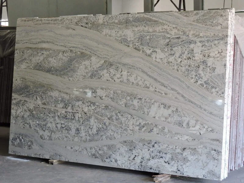 White granite slab with wide grey and black flowing veins