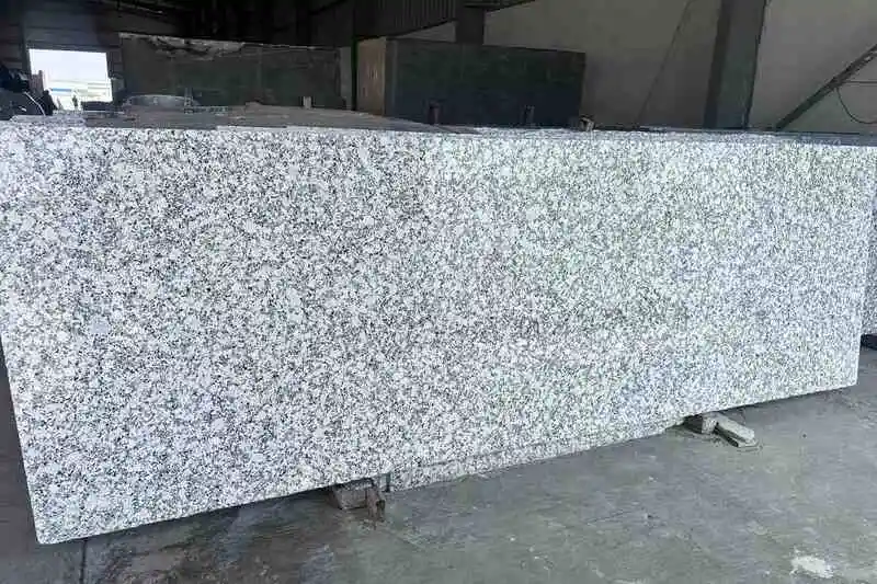 Granite slab with dense salt and pepper pattern made of fine black and white mineral grains