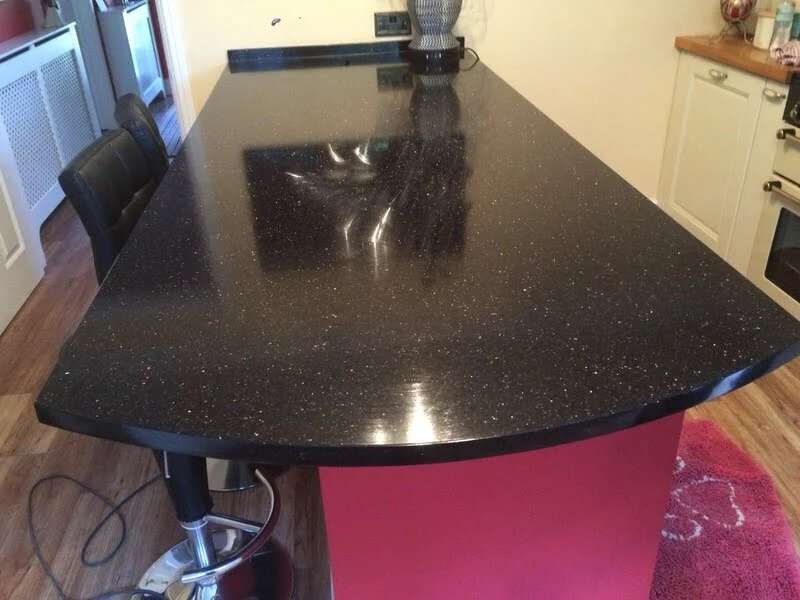 Polished Black Galaxy Granite kitchen countertop featuring deep black base with metallic gold flecks—classic black granite with gold for modern kitchens.