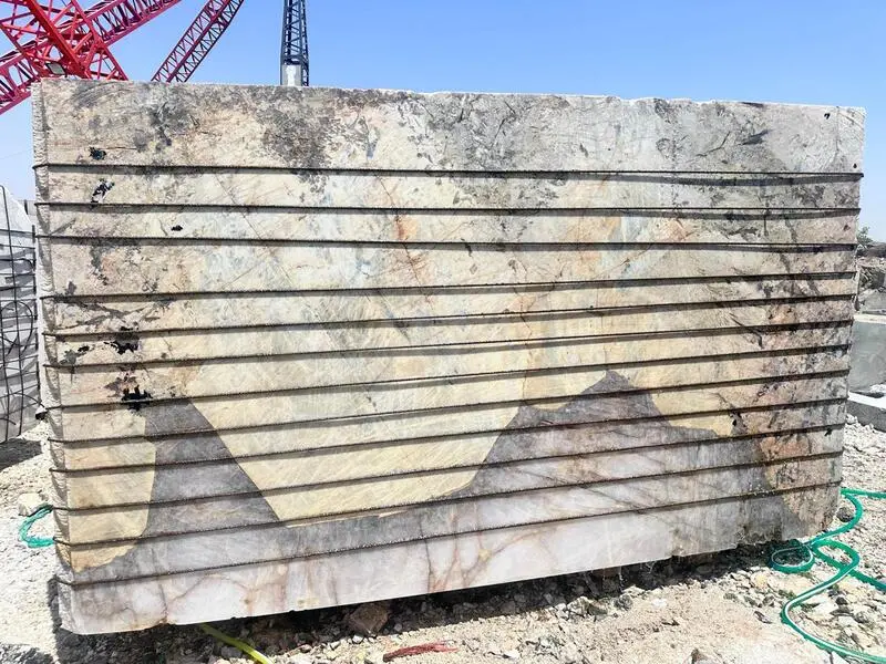 Image: Patagonia Quartzite block with temporary reinforcement strapping for safe movement. Final vacuum reinforcement will be done at processing unit before slab production begins.