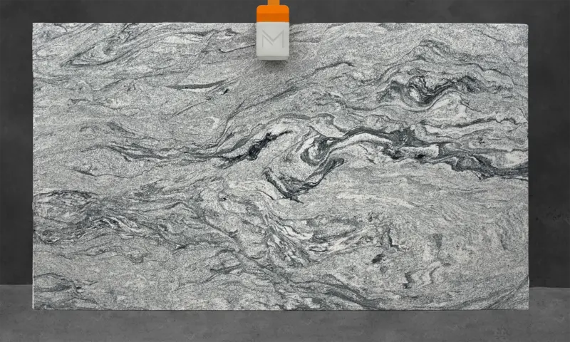 White granite slab with dark grey and black swirls across the surface